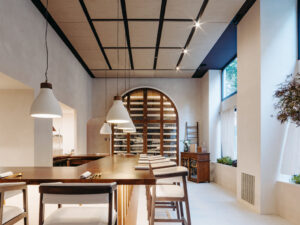 Interior de un restaurante moderno con barra y luz natural