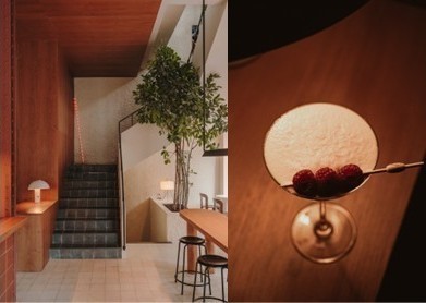 Interior del restaurante Llama Inn con cóctel decorado con frambuesas